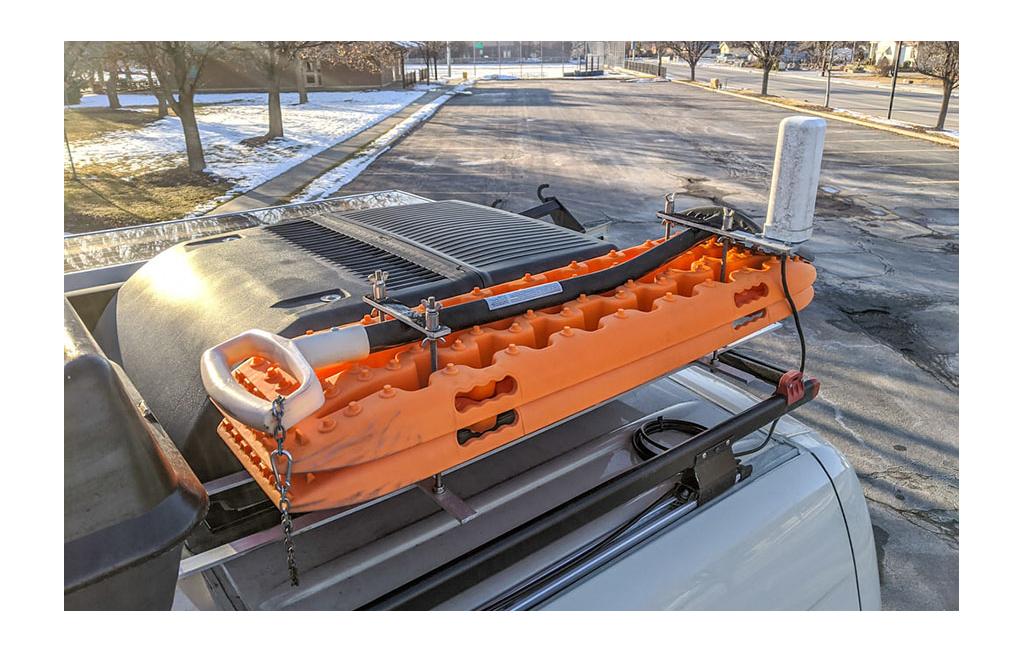 Recovery tracks and shovel on rack on top of Winnebago Revel.