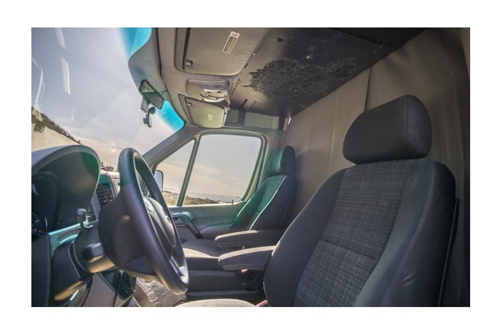 Front interior cab view of black out curtains in Winnebago Revel