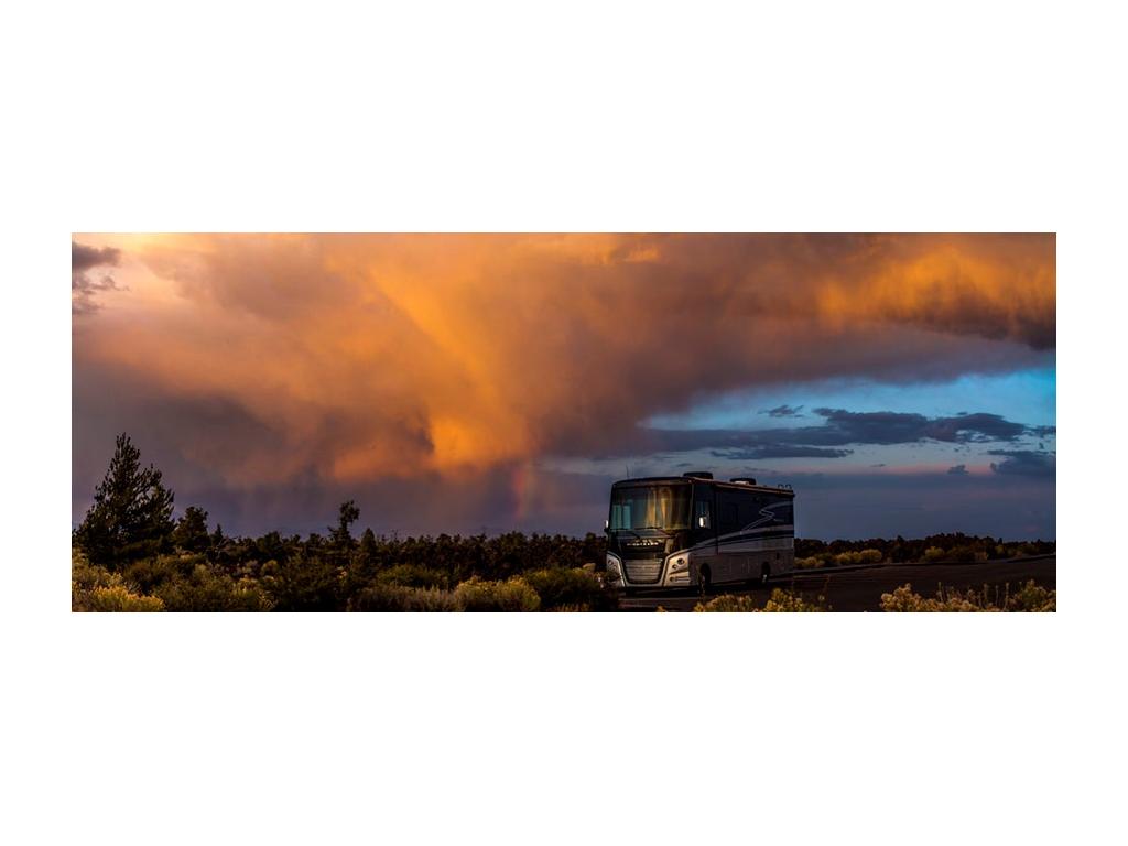 Bright sunset above Adventurer in green field