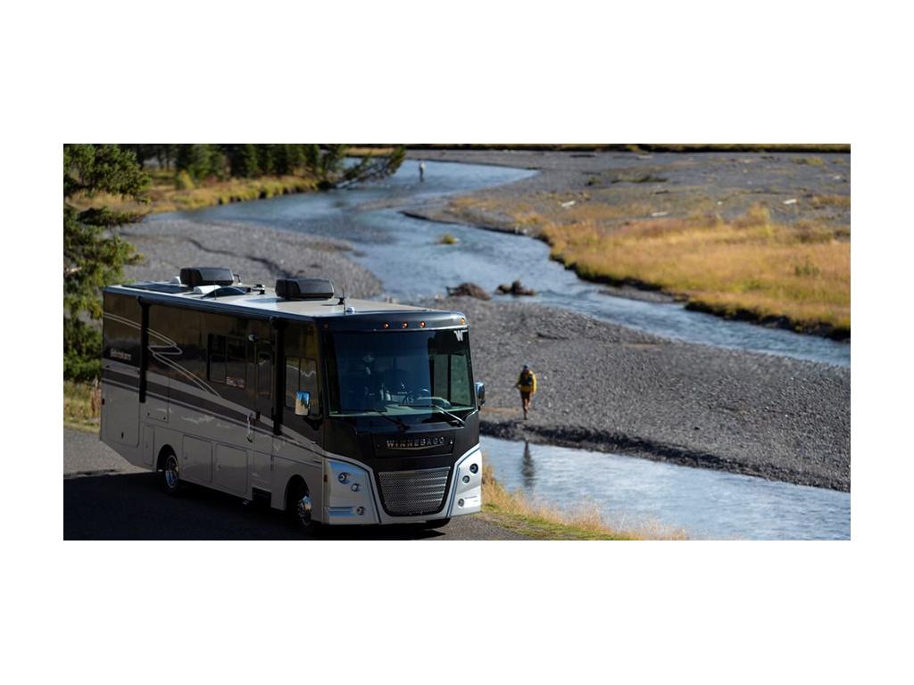 Adventurer parked next to river