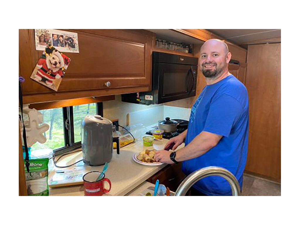 Kenny cooking in Winnebago Vista