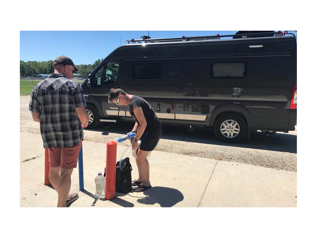 James teaching Noel how to fill fresh water