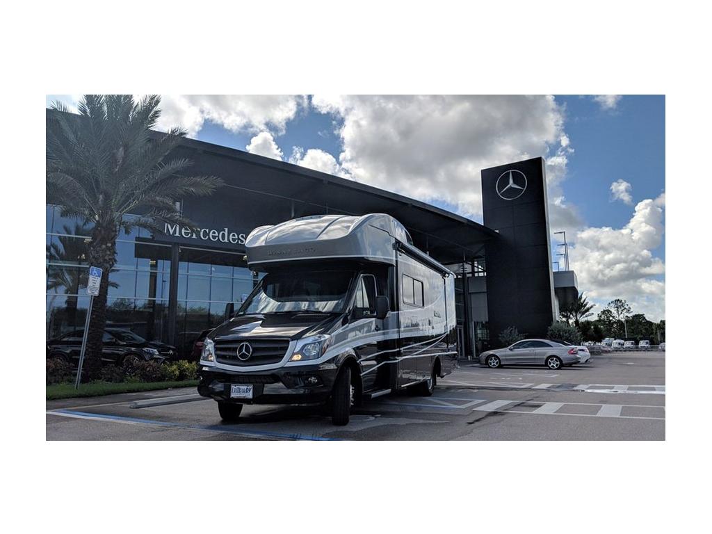 Navion parked in front of Mercedes dealer