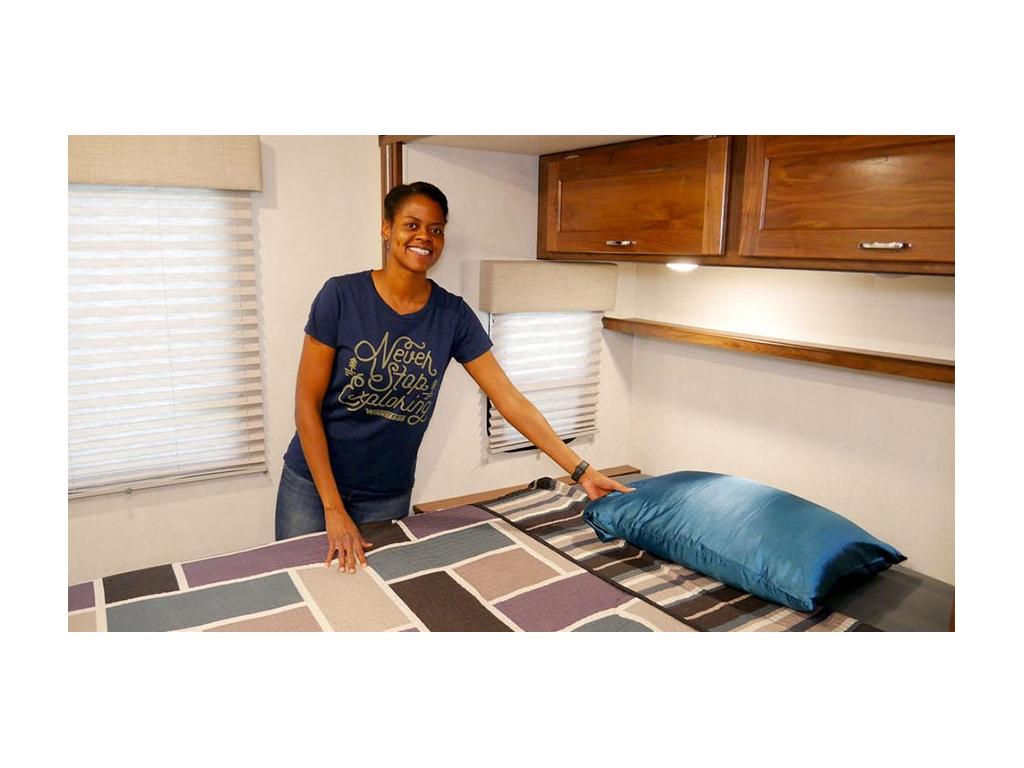 Sabrina making bed in Vita