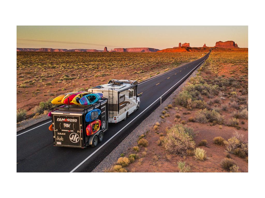 Winnebago View pulling trailer with kayaking gear