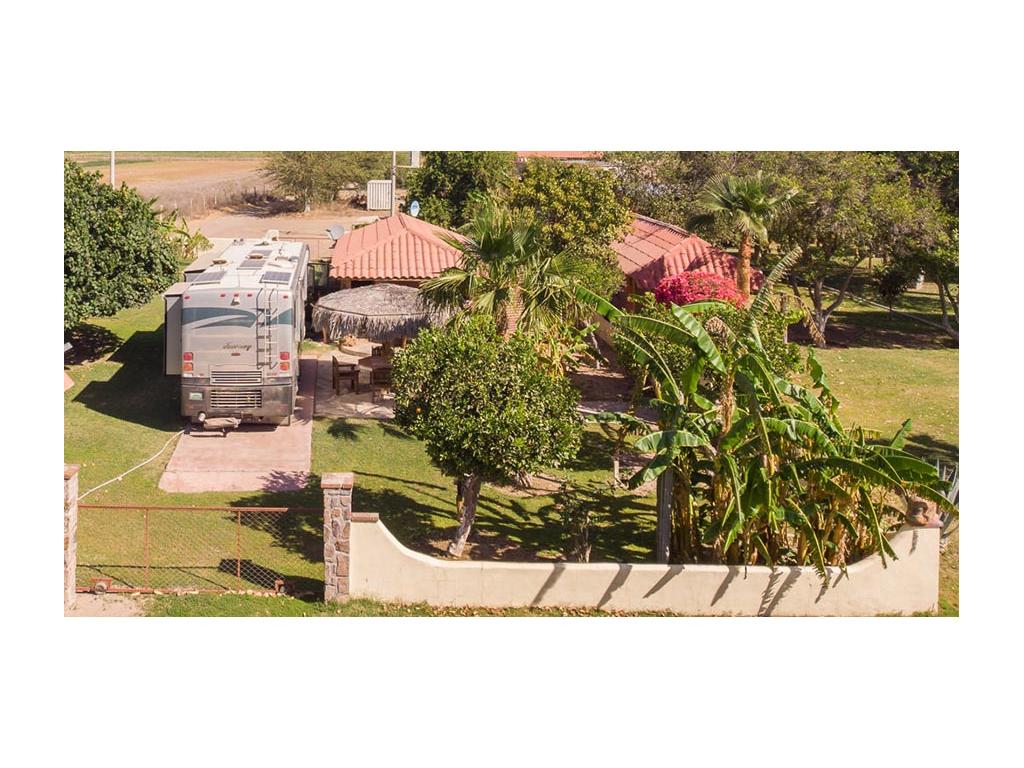 Journey parked next to house with fenced in yard