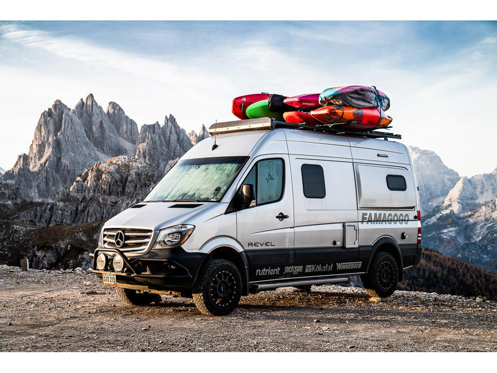 Winnebago Revel parked with Dolomites in Italy in background