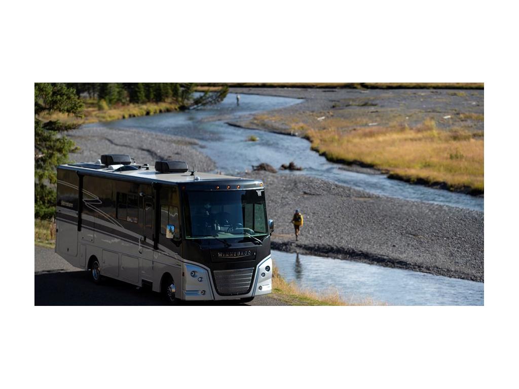 Adventurer parked next to river
