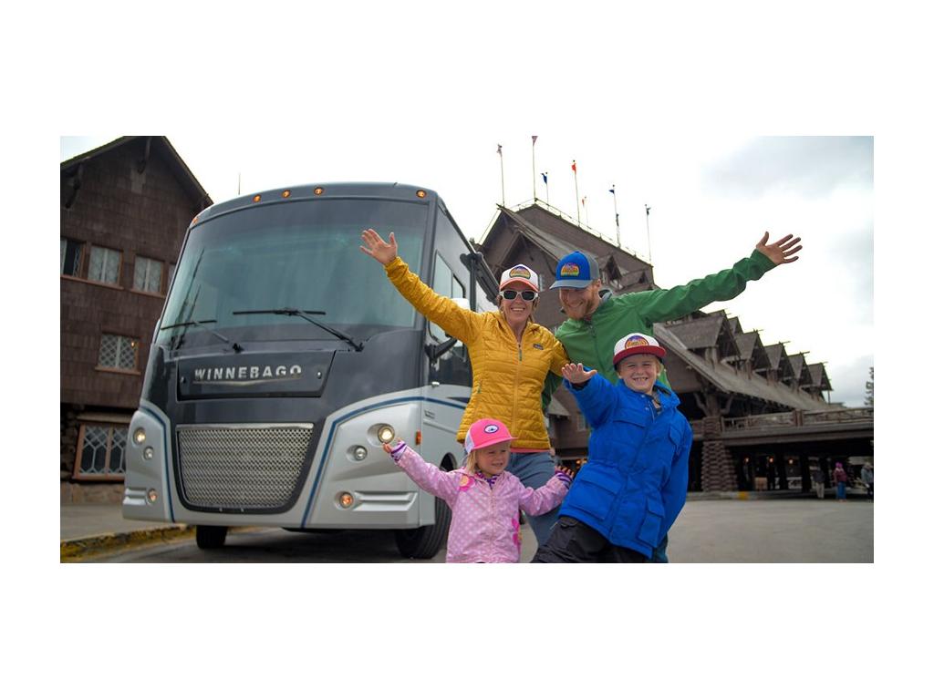 Pyke family in front of Winnebago Adventurer