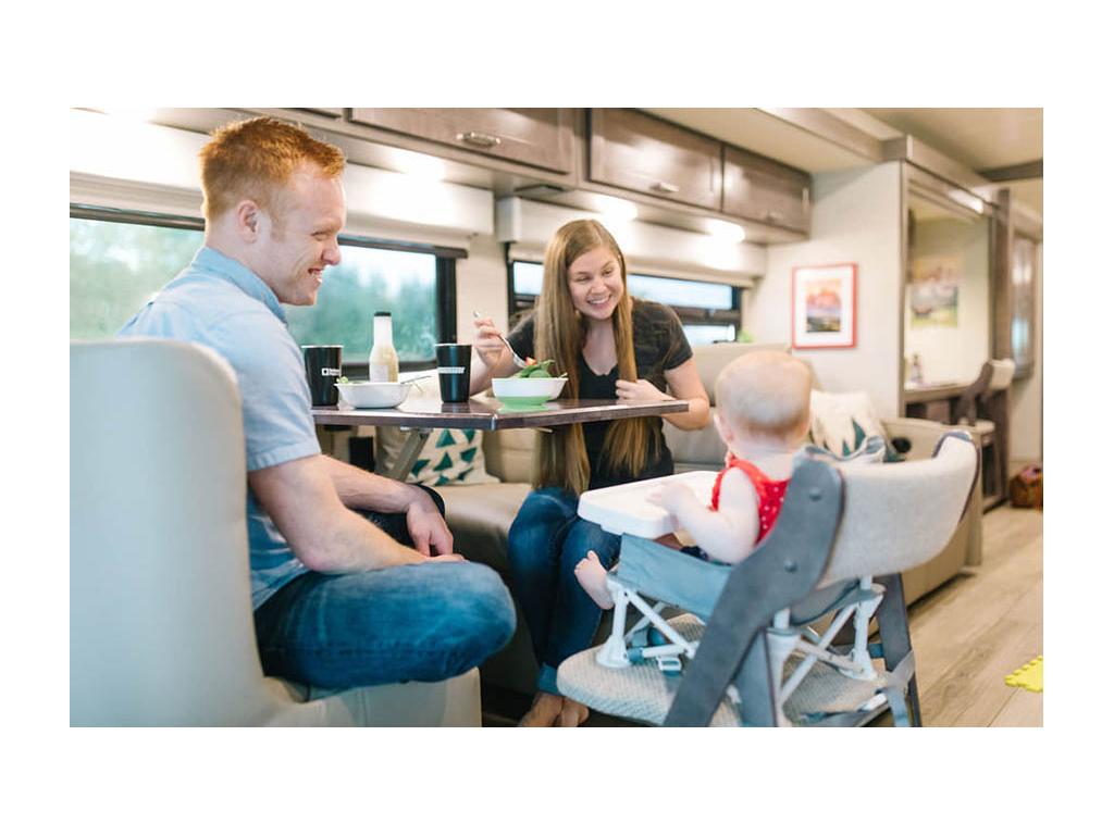 Alyssa and Heath feeding Eli at dinette in Forza