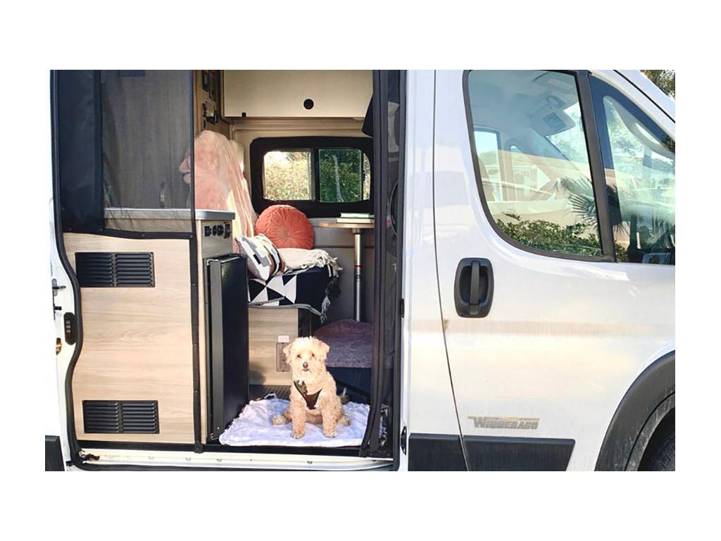 Digger sitting inside doorway of Solis