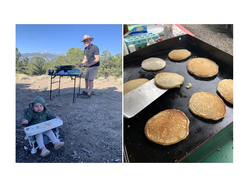 Heath grilling pancakes outside with Ellie sitting in booster chair eating