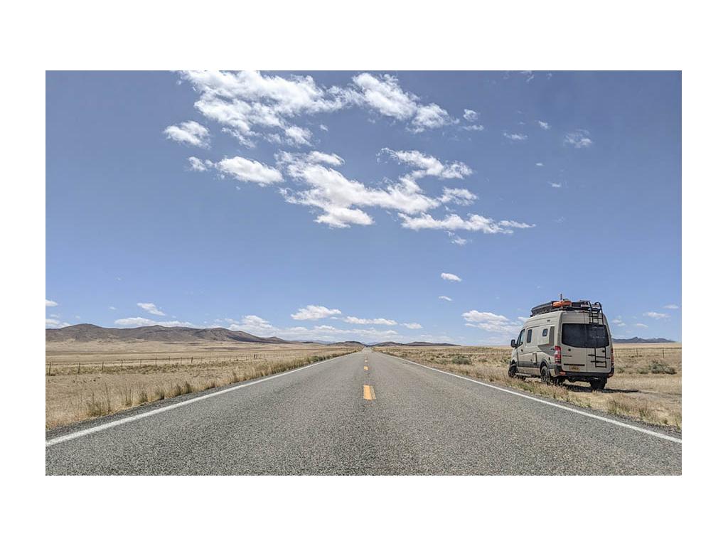 Revel parked on the side of an empty road