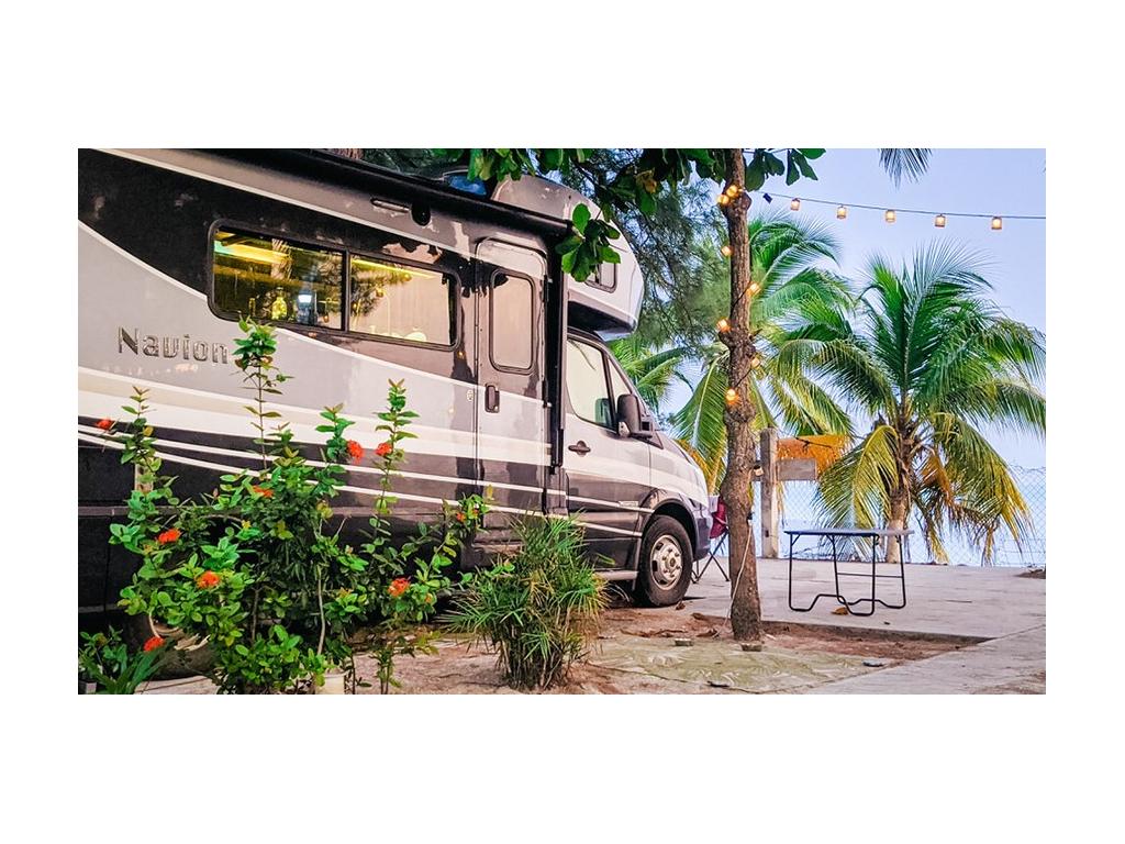 Navion parked on beach in Mexico