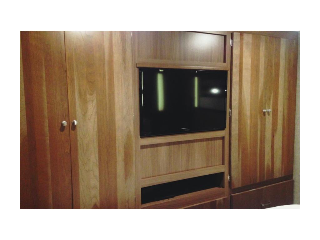 Bedroom cabinetry and TV.