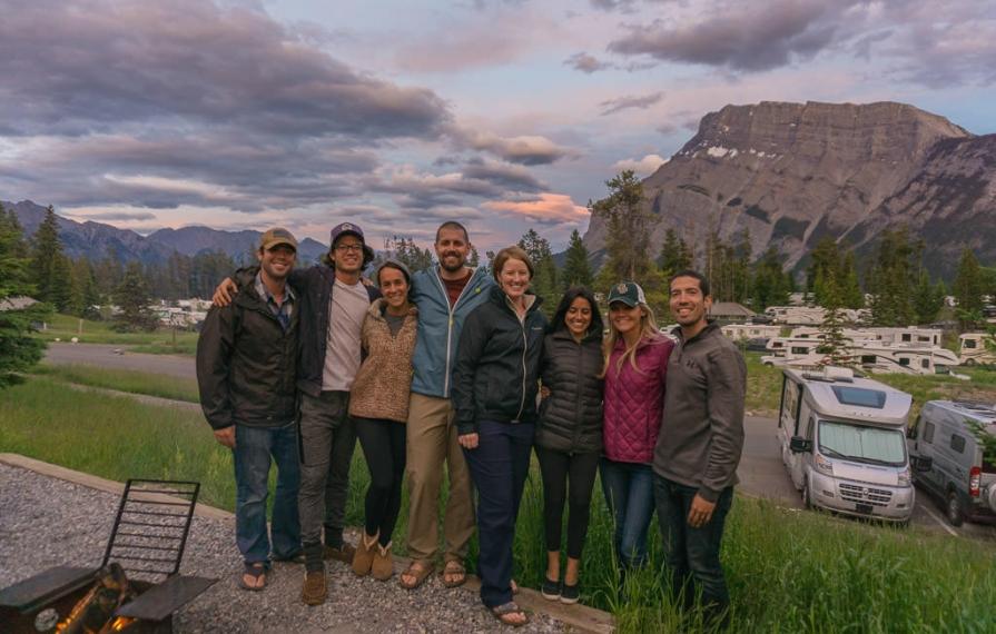 Dan and Lindsay huddled with friends