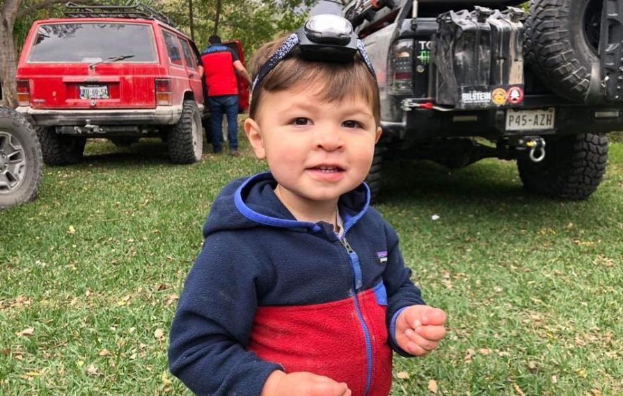 Caspian wearing a head lamp smiling
