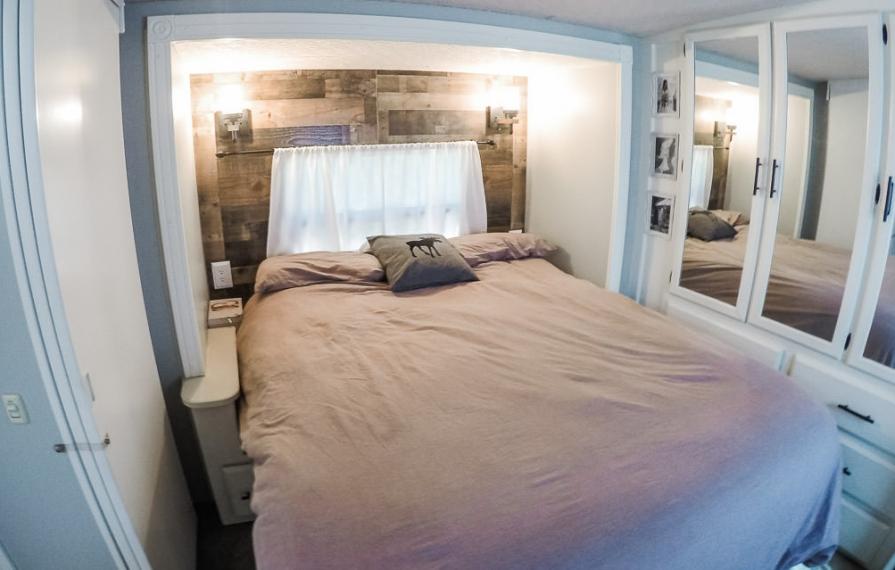 White walls with blue accents in finished bedroom