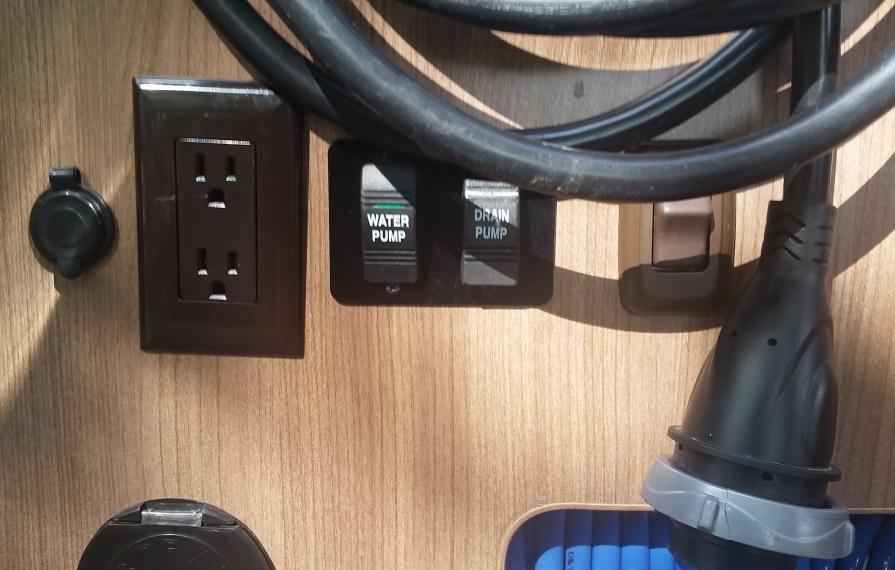 Drain pump button on the interior of the motorhome.