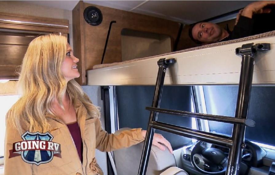 Lindsay looking at Dan laying in overhead bunk