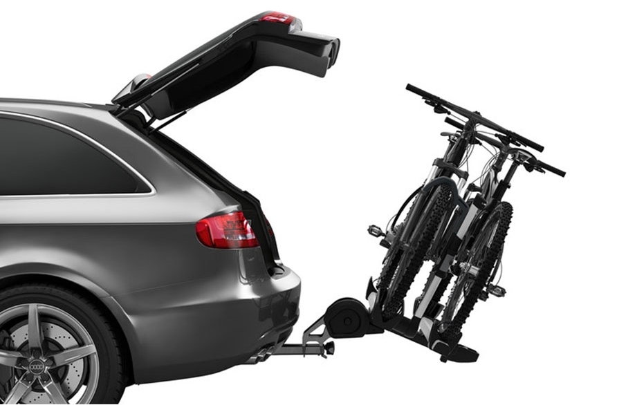 Bikes on a bike rack attached to a vehicle.