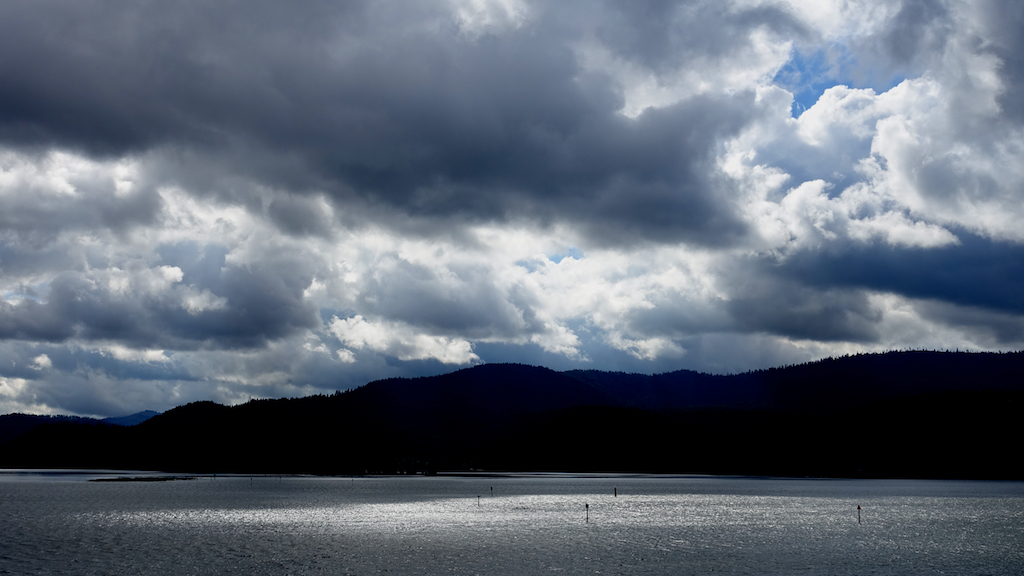 Bluffs on the opposite side of a body of water. 