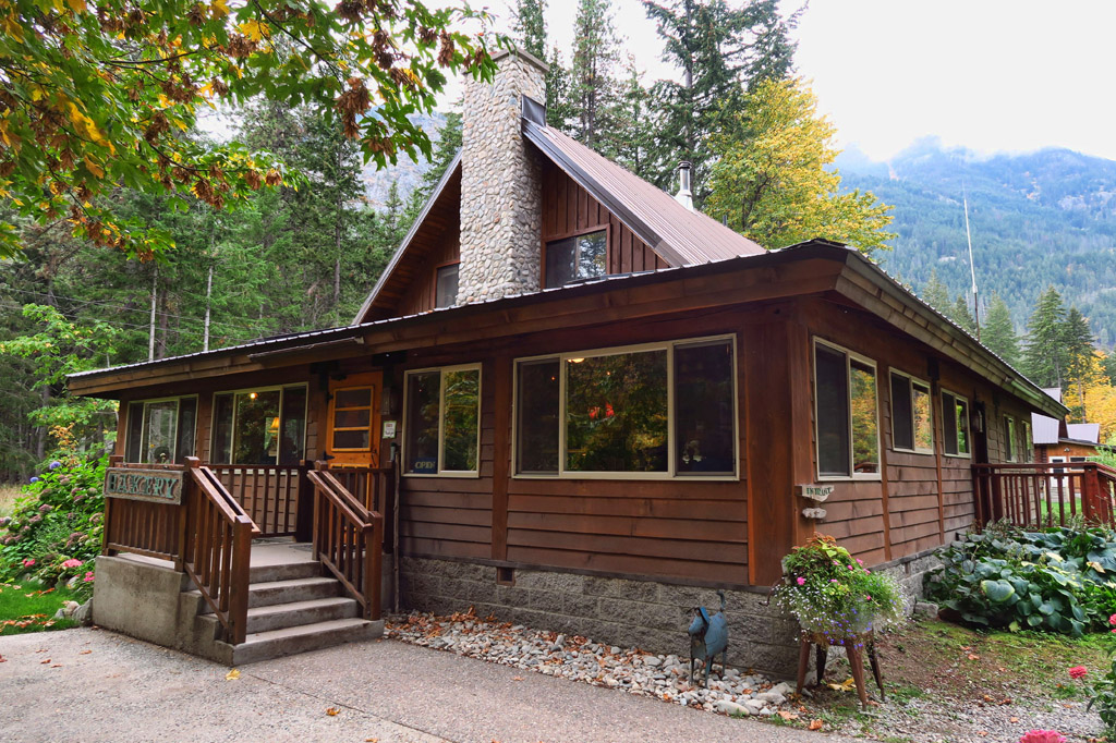 Cabin style lodge among the trees.