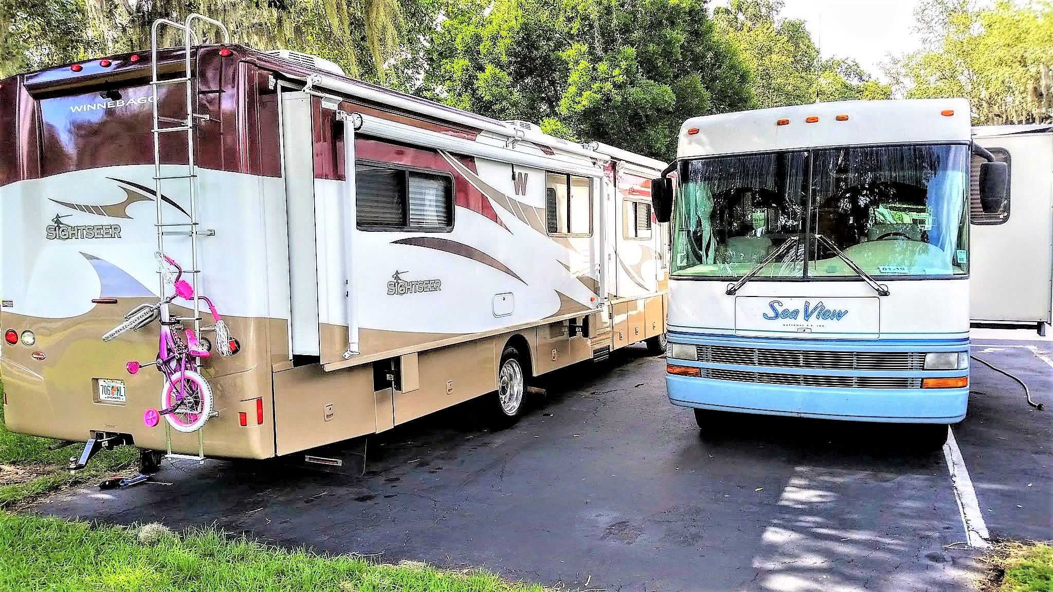 Winnebago Sightseer in parking spot next to another motorhome.