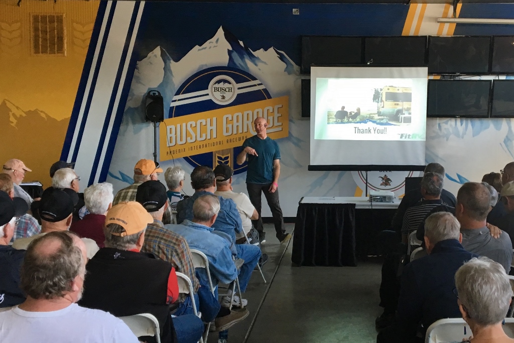 James presenting a seminar to a gorup of people.