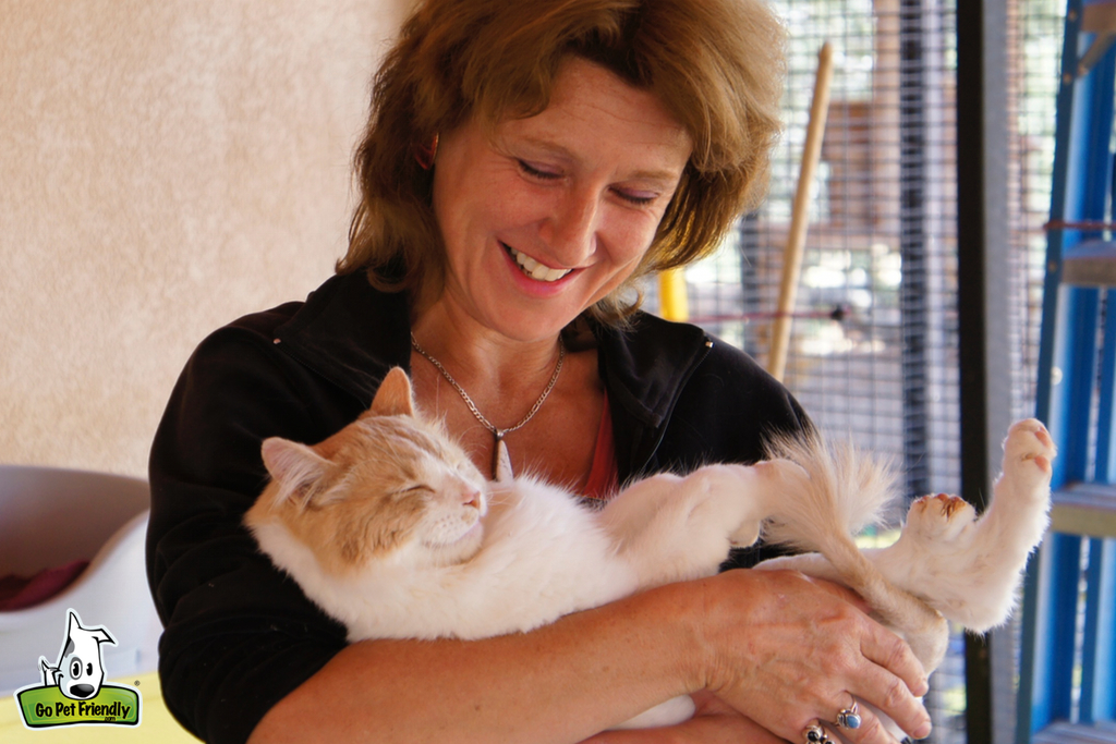 Woman holding a cat.