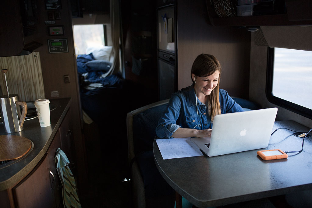 Woman working on her laptop at the dinette.