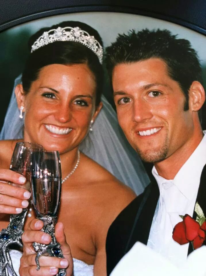 Couple in wedding attire.