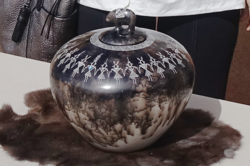 Smoky dripped glaze style pottery piece with a bear carved on the lid.