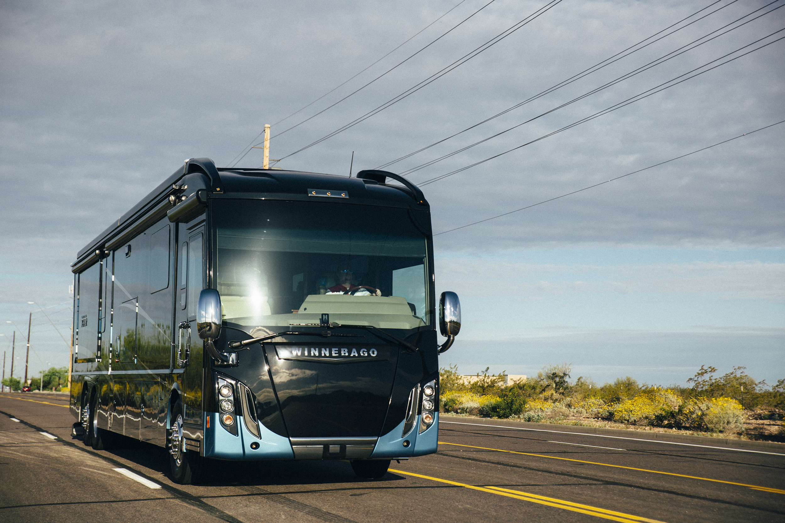 Winnebago Grand Tour driving down the highway.