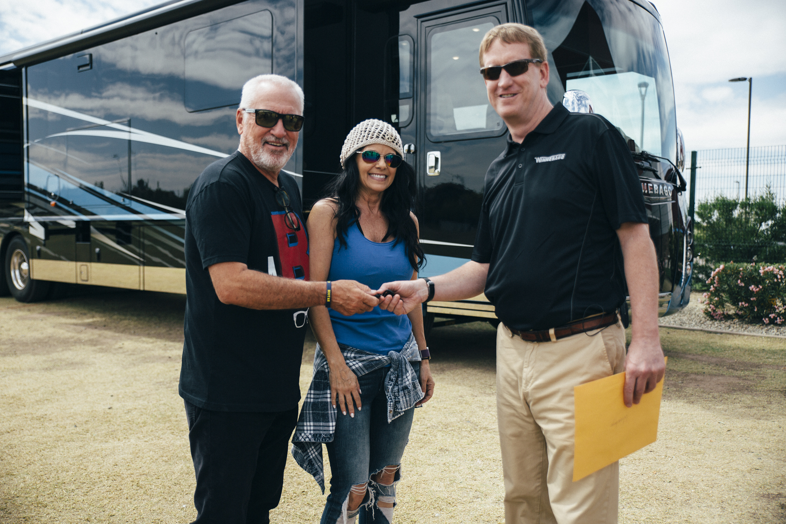 Brian Hazleton handing over the keys to Joe & Jaye Maddon.