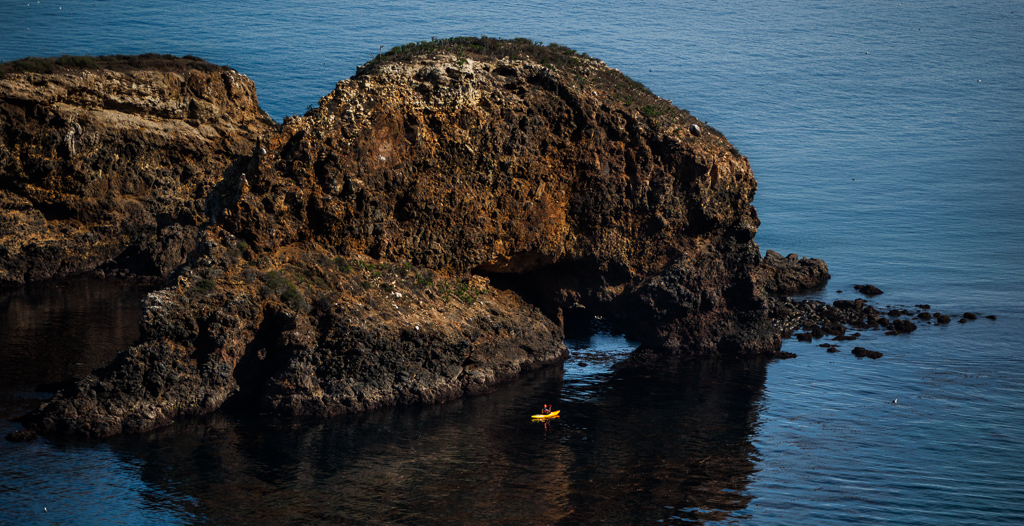 Peter exploring a sea cave at the edge of the island.