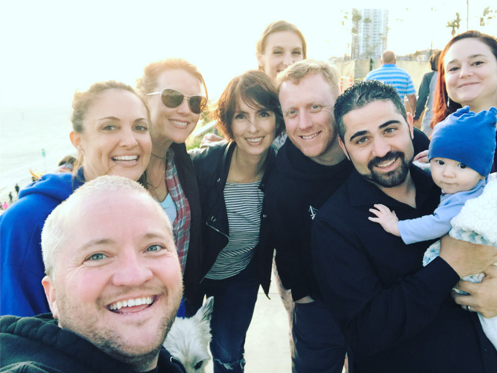 Group of people taking a selfie.