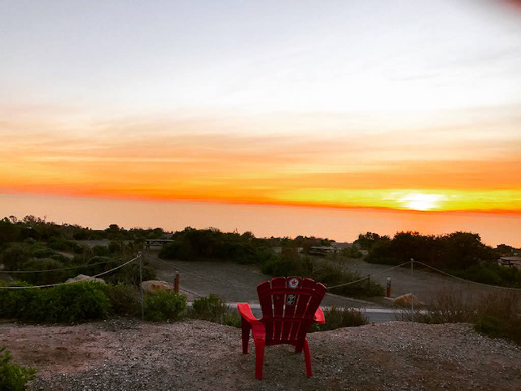 View from high hillside overlooking water below.