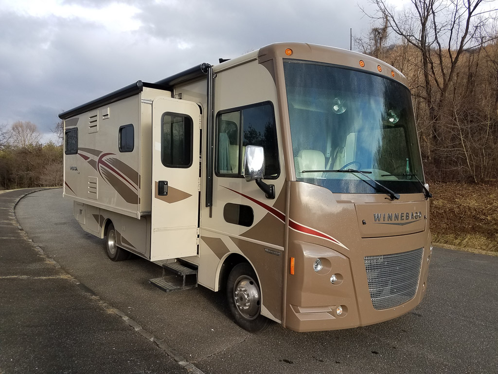 Winnebago Vista parked on the side of the road.