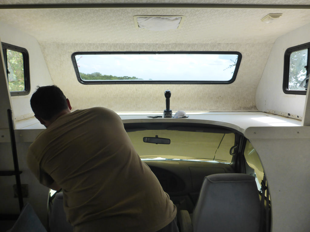 Jeremy working on front bunk area of motorhome.