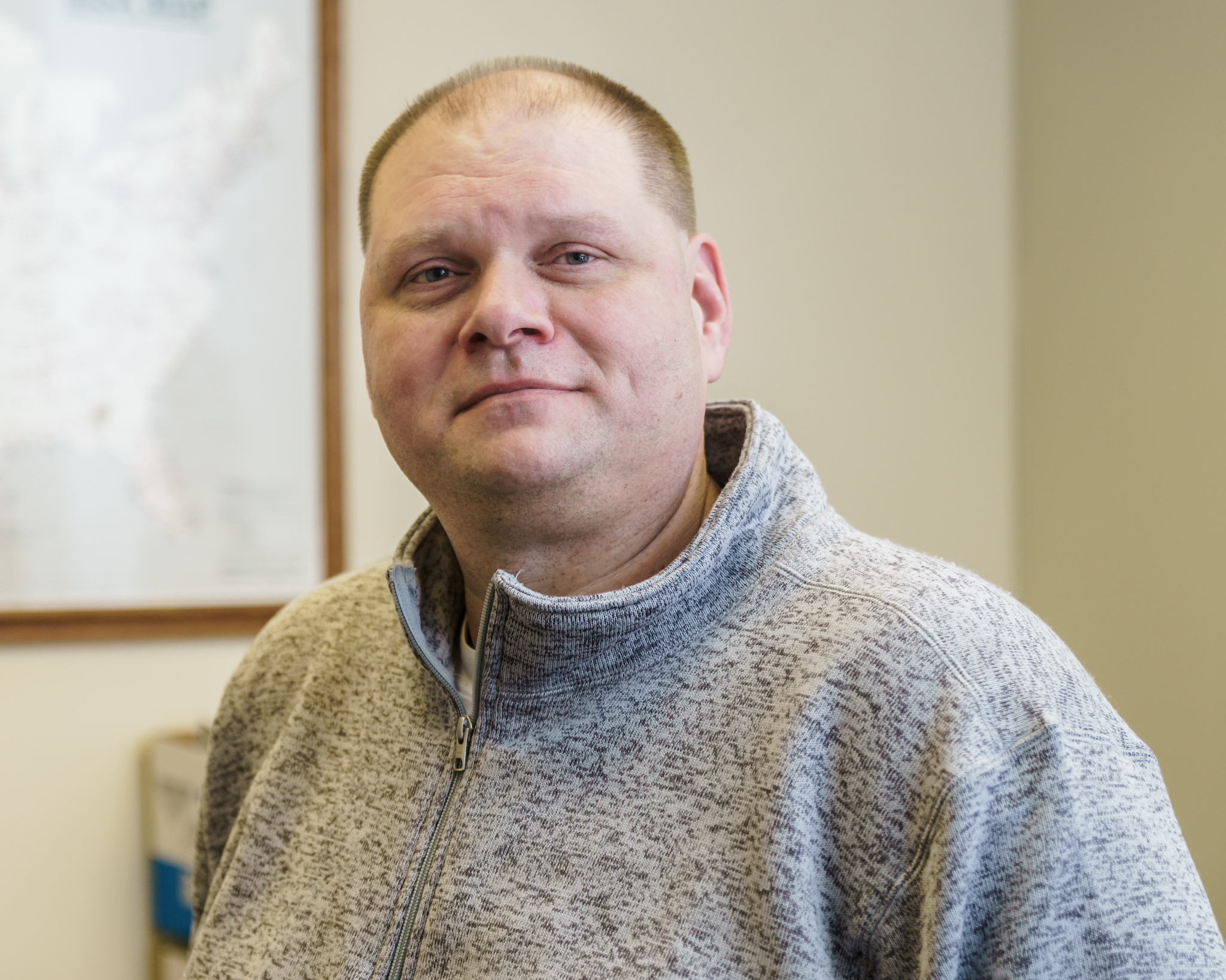 Bob Ritter smiling in office.