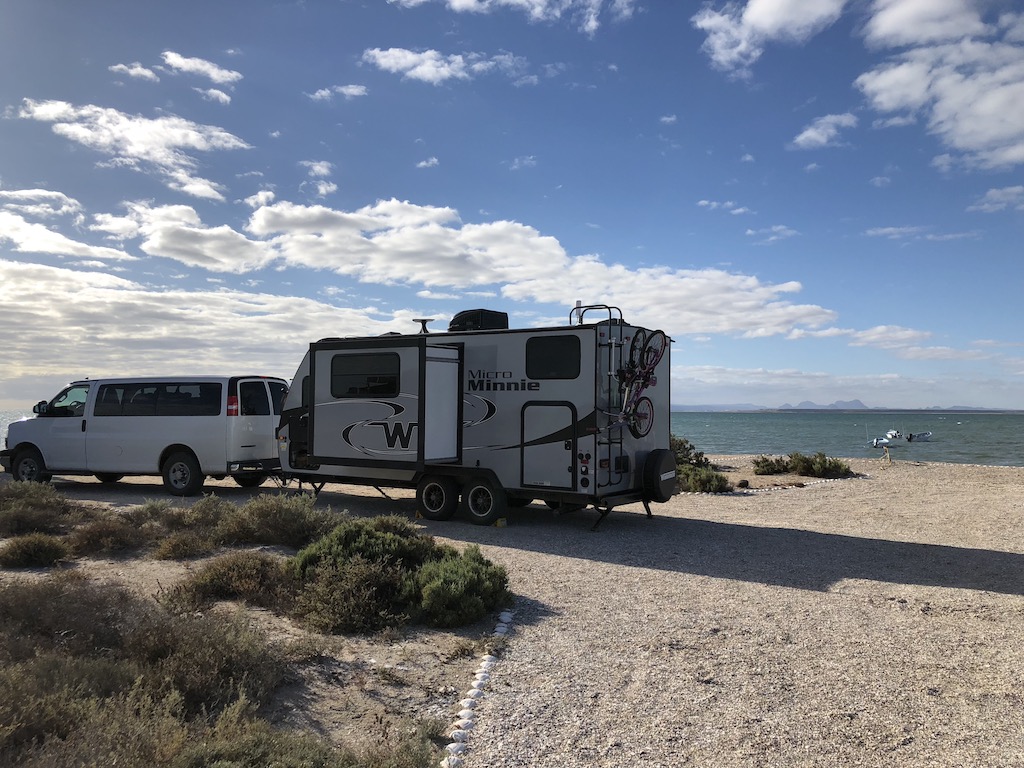 Van and Micro Minnie parked in campsite on beach