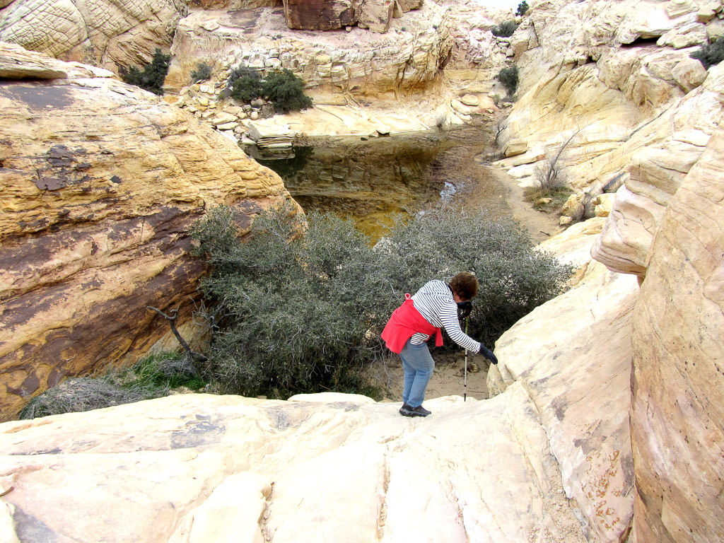 Woman hiking along rocks