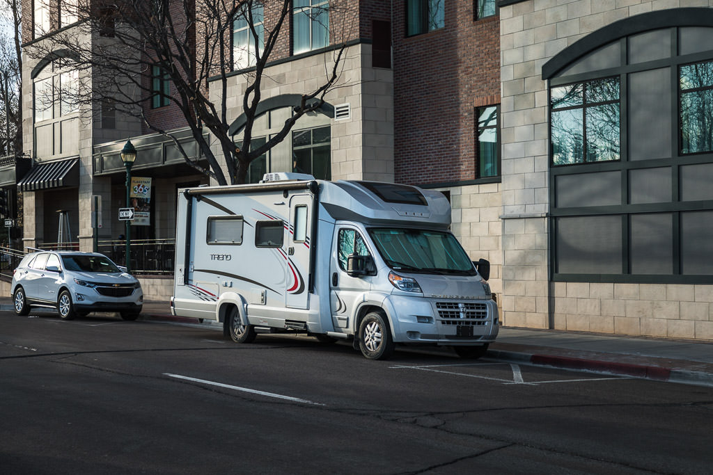 Winnebago Trend parked on the street in front of buildings downtown