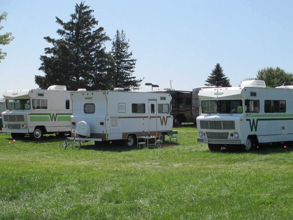 Three Winnebago Indians parked at the Winnebago Grand National Rally