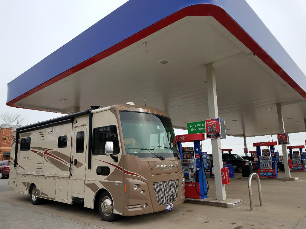 Winnebago Vista being filled up at gas station 