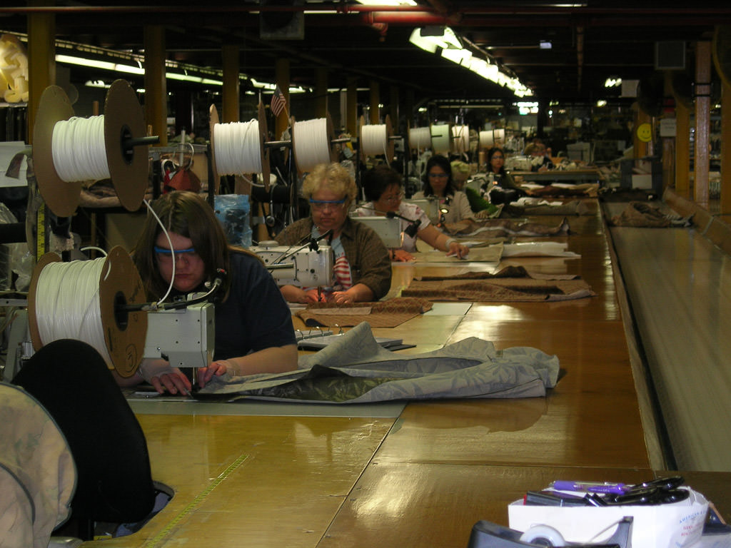 People lined up at sewing stations in Stitchcraft building