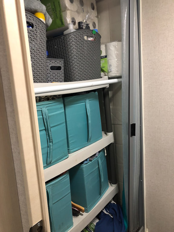 Storage bins on shelf in shower
