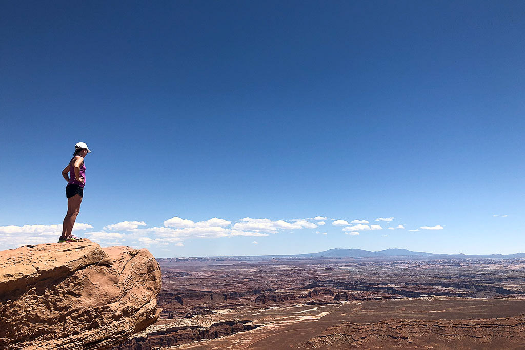 Brittany overlooking the canyonlands from a rocky overlook