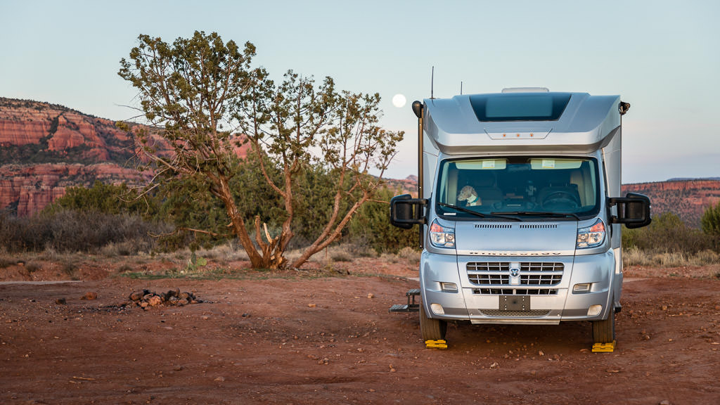 Front view of Winnebago Trend in camp in a desert climate